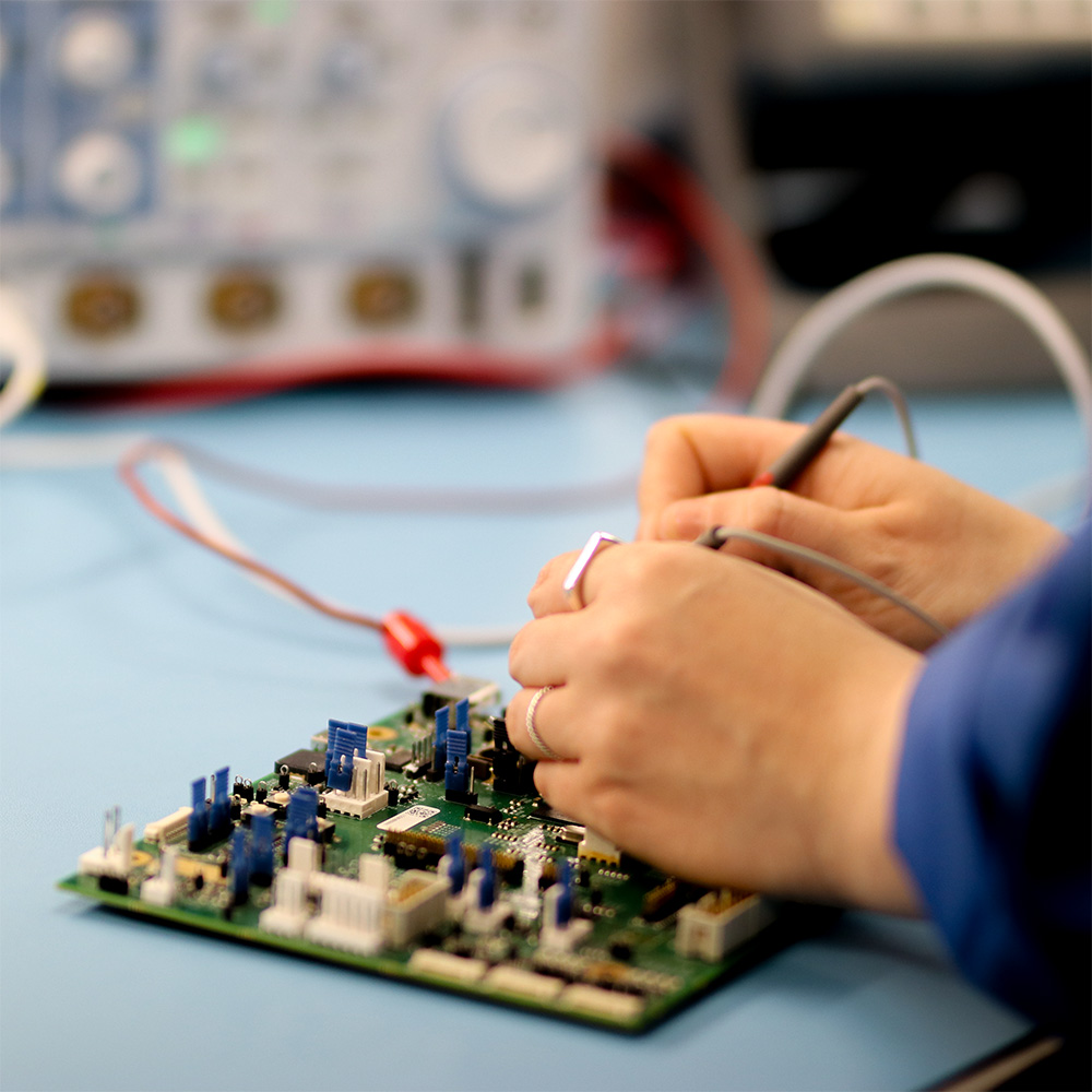 Hands soldering electronics