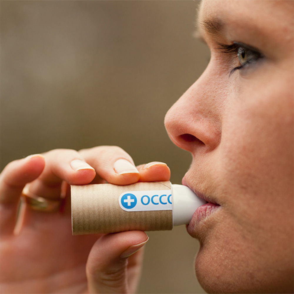 Woman using an-inhaler