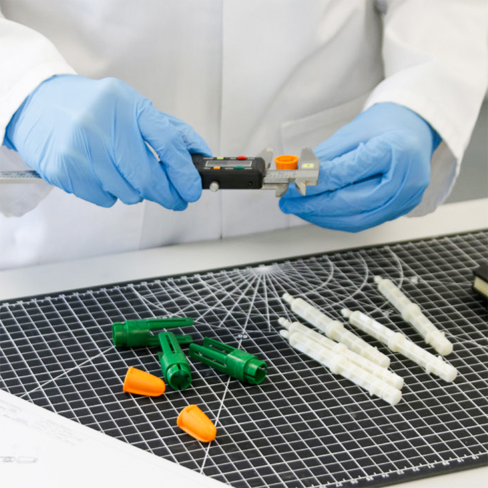 images-of-components-of-an-auto-injector-trainer-pen-on-a-lab-bench